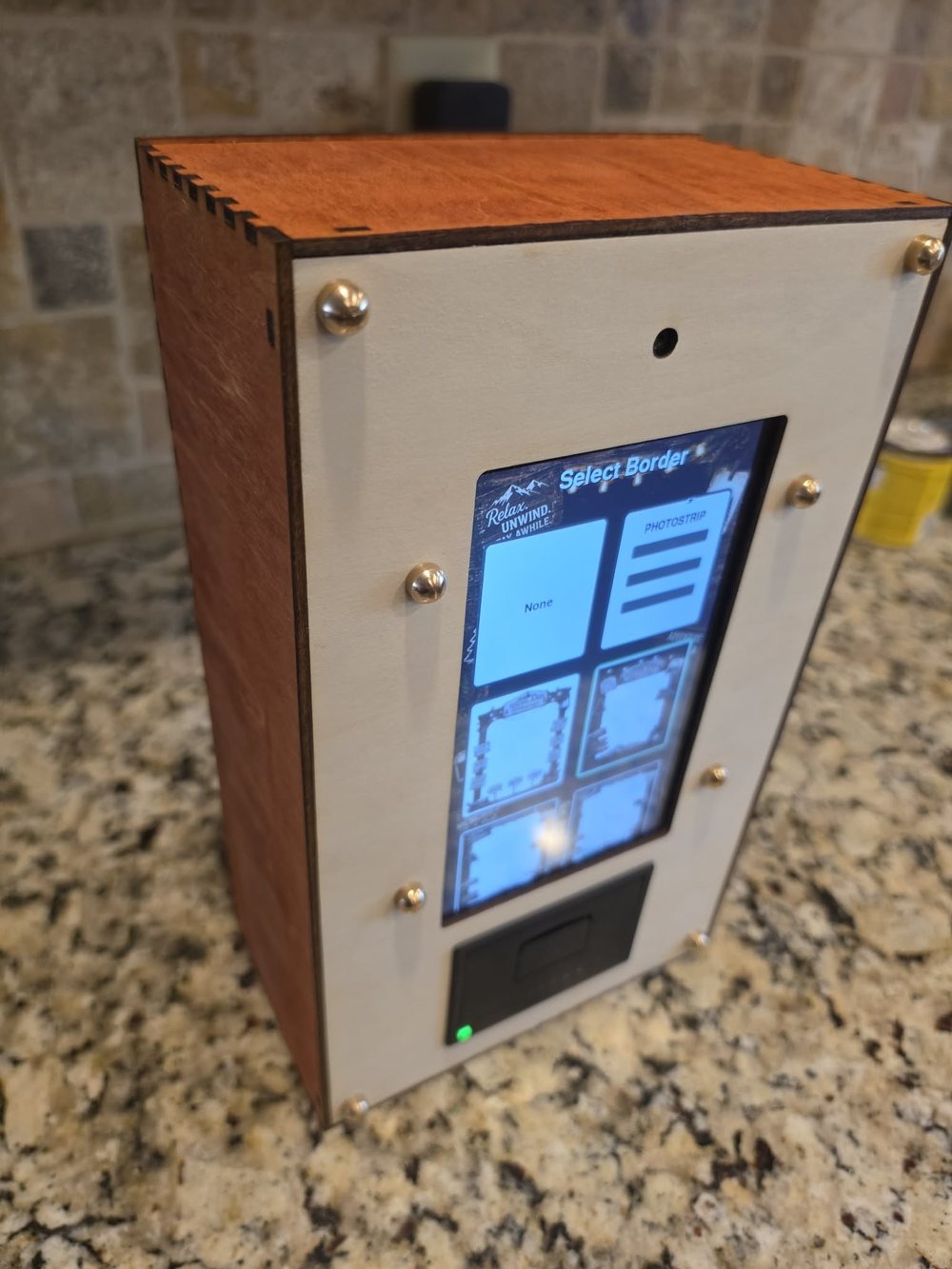 Paperbooth unit, close angle showing the paper output slot